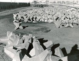 Concrete tetrahedrons, or "jackstones" stockpiled for placement on Kingsley Dam