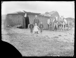 George Barnes with three motherless children and a caved-in soddy, 1887