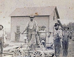 Railroad workers laying track, possibly in Bennington, NE area, ca. 1889