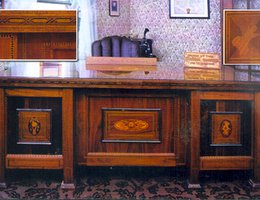 Father Flanagan’s desk, with inset pictures showing inlaid wood details