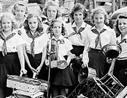 Camp Fire girls with the scrap they collected in September 1942