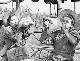 Women taking a break after detasseling corn; Lancaster County, Nebraska, July 1943