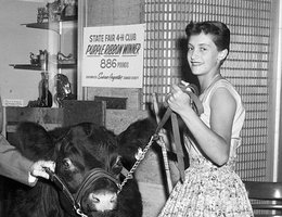 Susan Aegerter from Seward County with her prize 4-H steer at the Cornhusker Hotel, 1956
